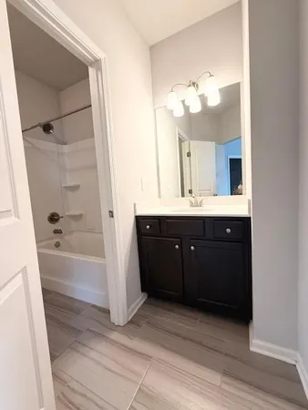 a backyard of a house with barbeque oven and outdoor seating