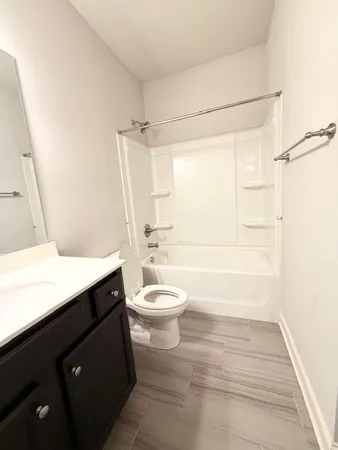 a view of a room with cabinet a flat screen tv and windows