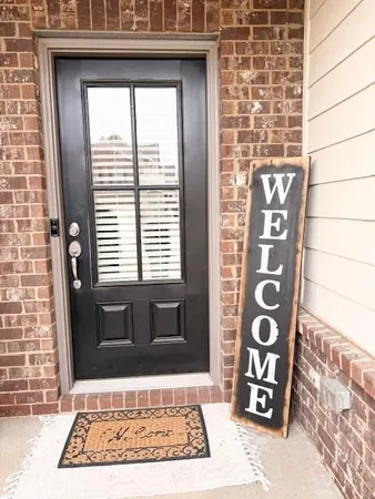 a view of a kitchen with a stove wooden cabinets and a fireplace
