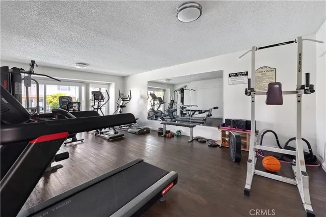 a living room with furniture gym equipment and a view of living room