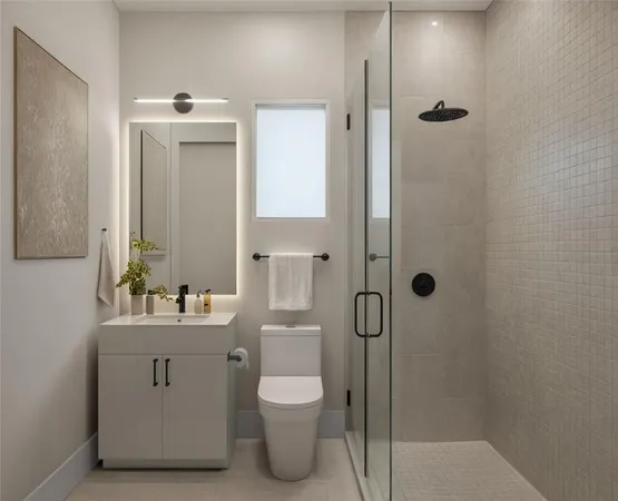 a bathroom with a toilet sink shower and mirror