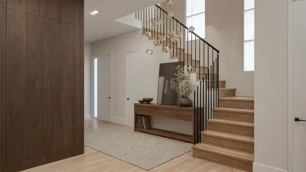 a view of entryway and hall with wooden floor