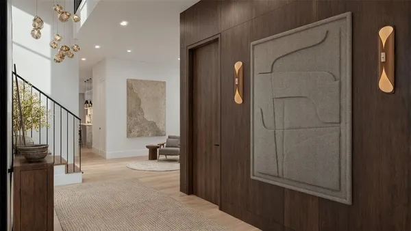 a view of a hallway with windows and entryway