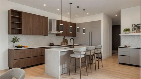 a kitchen with stainless steel appliances granite countertop a sink a stove a refrigerator cabinets and chairs