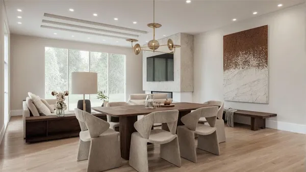 a view of a a dining room with furniture window and wooden floor