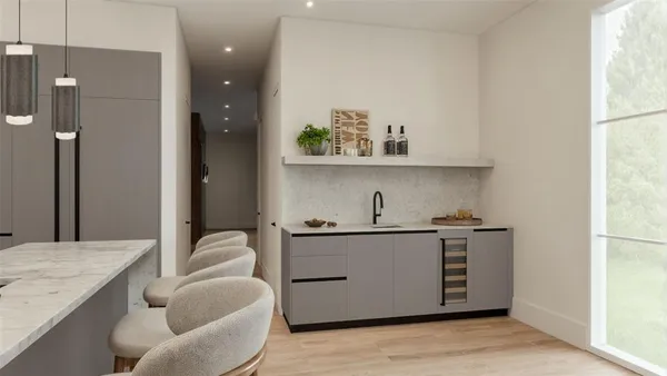 a kitchen with stainless steel appliances granite countertop a sink and a refrigerator