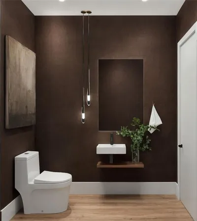 a bathroom with a toilet and a sink