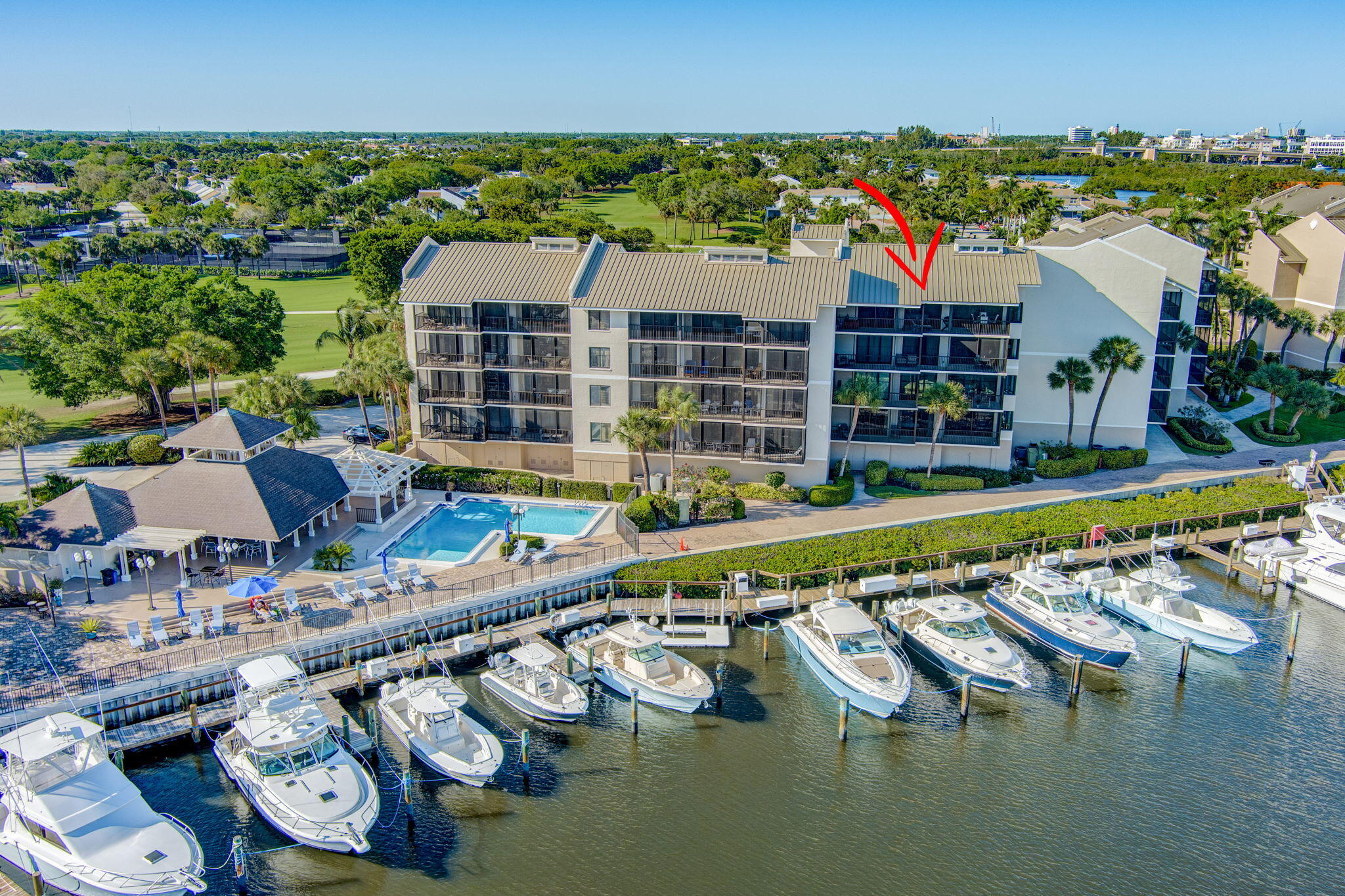 16910 Bay Street, Unit E503 Jupiter, FL 33477 - Photo 2 of 33 a view of swimming pool with outdoor seating and city view