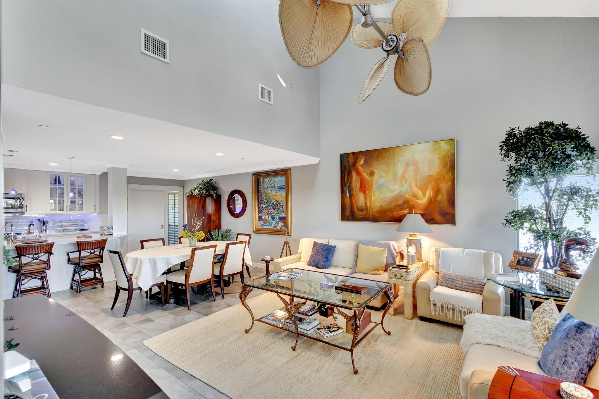 16910 Bay Street, Unit E503 Jupiter, FL 33477 - Photo 23 of 33 a living room with furniture and a flat screen tv