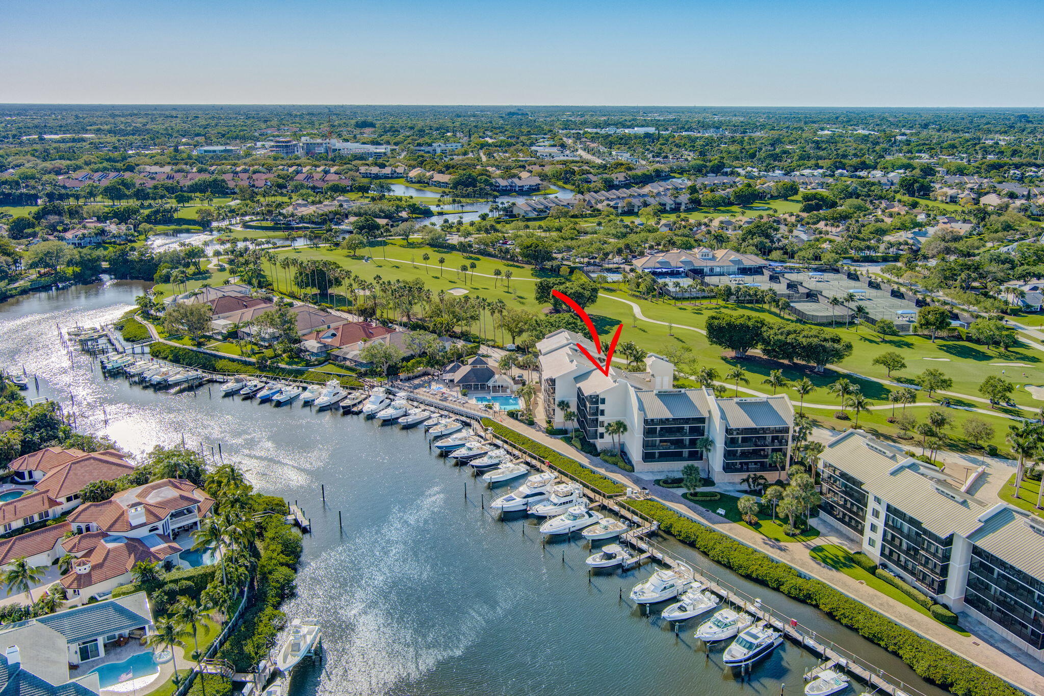 16910 Bay Street, Unit E503 Jupiter, FL 33477 - Photo 3 of 33 an aerial view of a city with lots of residential buildings