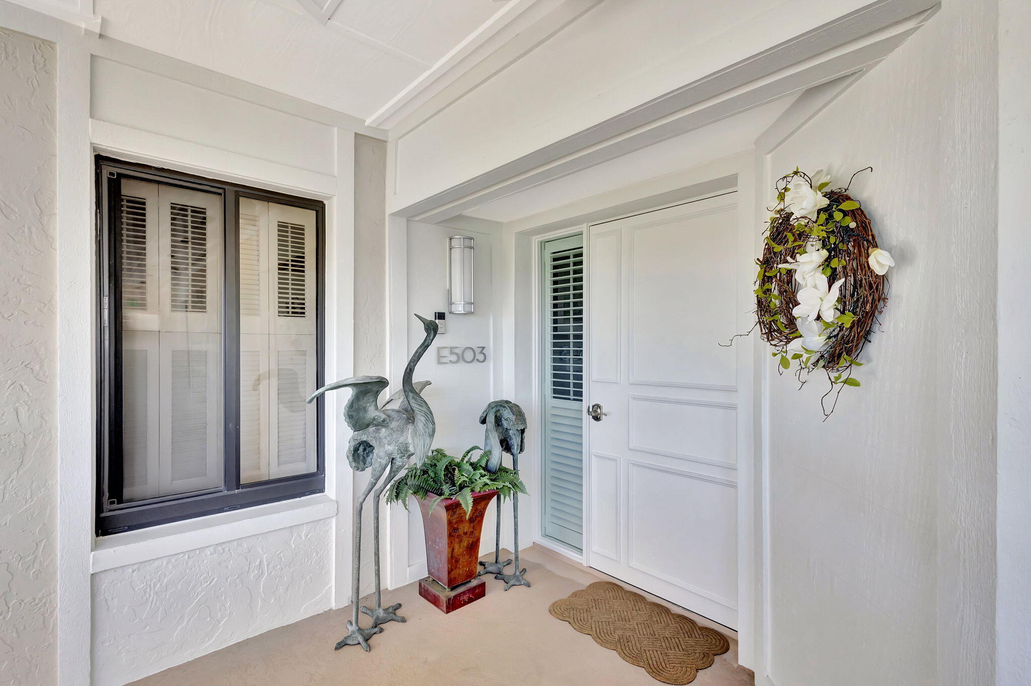 16910 Bay Street, Unit E503 Jupiter, FL 33477 - Photo 4 of 33 view of entryway with wooden floor