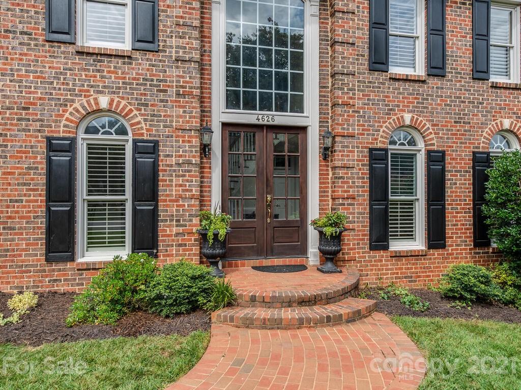 4626 Binfords Ridge Road Charlotte, NC 28226 - Photo 2 of 42 a front view of a house with a yard
