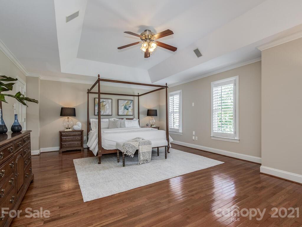 4626 Binfords Ridge Road Charlotte, NC 28226 - Photo 18 of 42 a living room with furniture and a chandelier