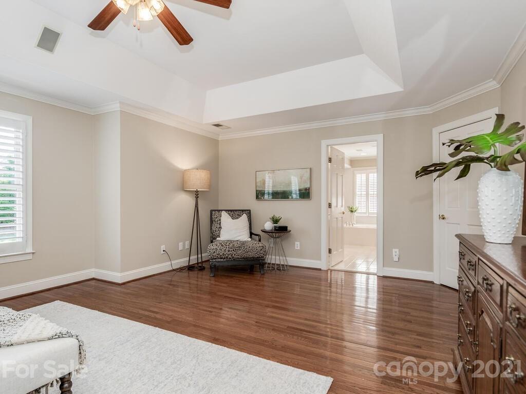 4626 Binfords Ridge Road Charlotte, NC 28226 - Photo 19 of 42 a living room with furniture and a chandelier