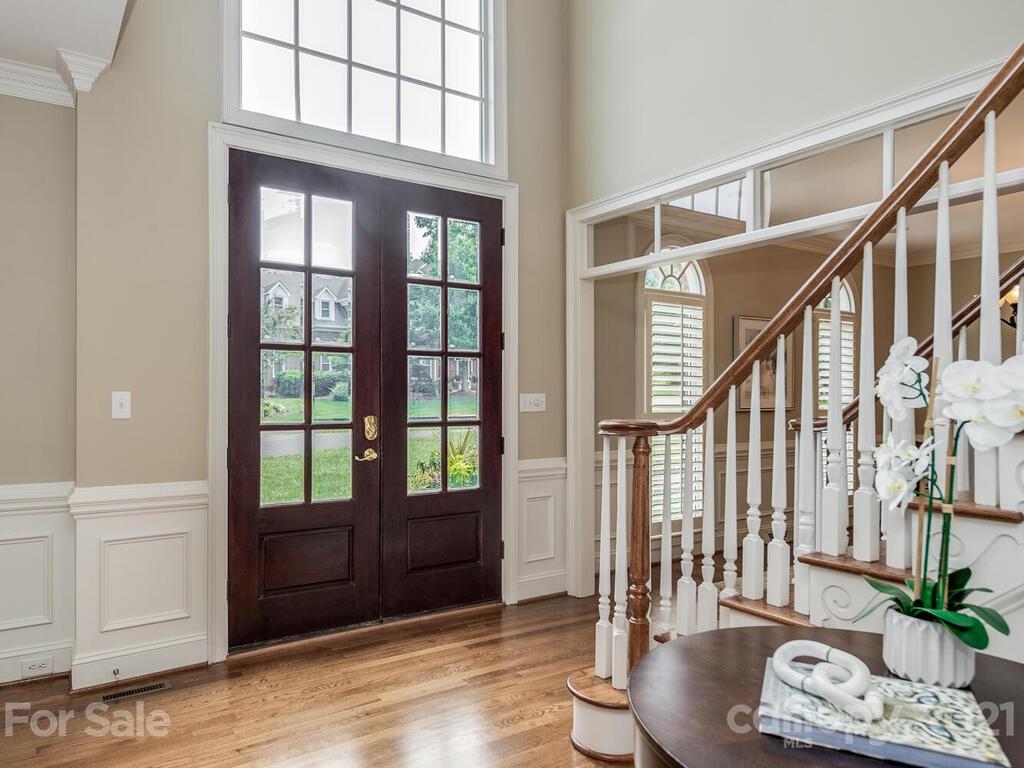 4626 Binfords Ridge Road Charlotte, NC 28226 - Photo 3 of 42 a view of an entryway with wooden floor and door