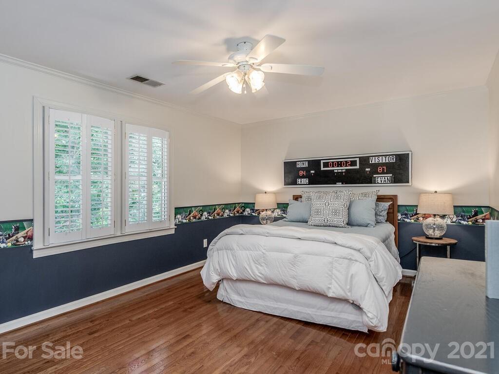 4626 Binfords Ridge Road Charlotte, NC 28226 - Photo 24 of 42 a bedroom with a large bed and a window