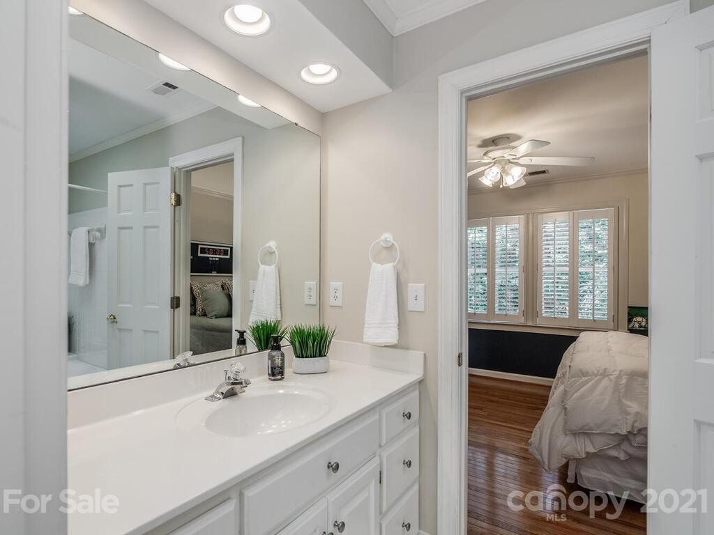 4626 Binfords Ridge Road Charlotte, NC 28226 - Photo 25 of 42 a en suite bathroom with a double vanity sink and a mirror