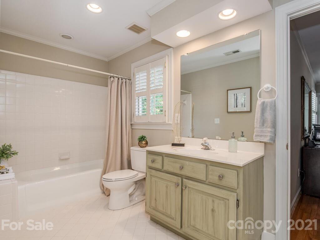 4626 Binfords Ridge Road Charlotte, NC 28226 - Photo 27 of 42 a bathroom with a sink toilet tub and shower
