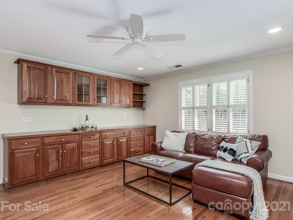 4626 Binfords Ridge Road Charlotte, NC 28226 - Photo 28 of 42 a living room with furniture a ceiling fan and a window