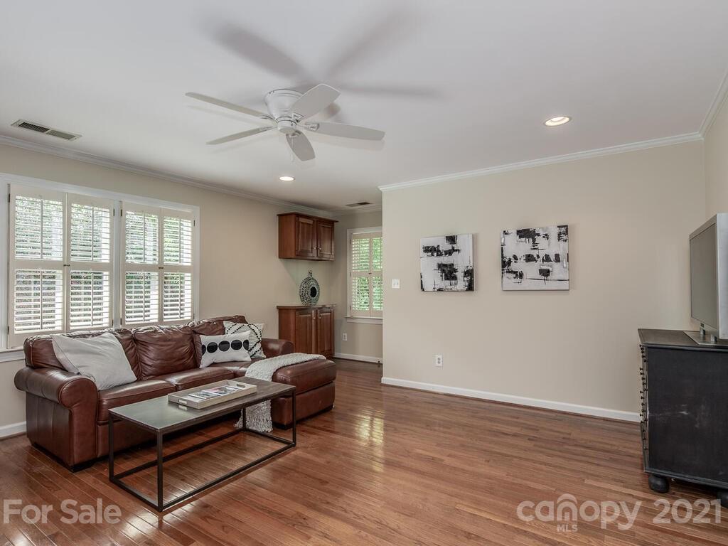 4626 Binfords Ridge Road Charlotte, NC 28226 - Photo 29 of 42 a living room with furniture and a flat screen tv