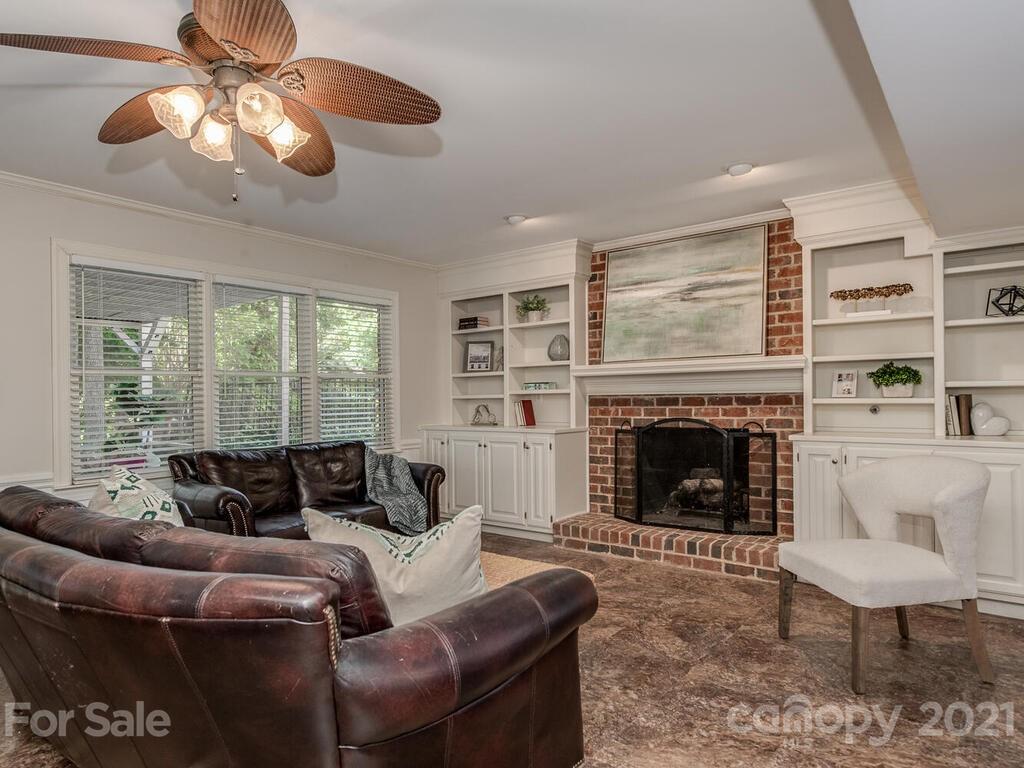 4626 Binfords Ridge Road Charlotte, NC 28226 - Photo 32 of 42 a living room with furniture and a fireplace