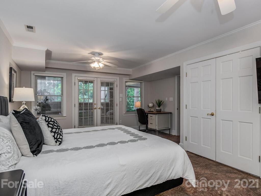 4626 Binfords Ridge Road Charlotte, NC 28226 - Photo 36 of 42 a bedroom with a large bed and a window