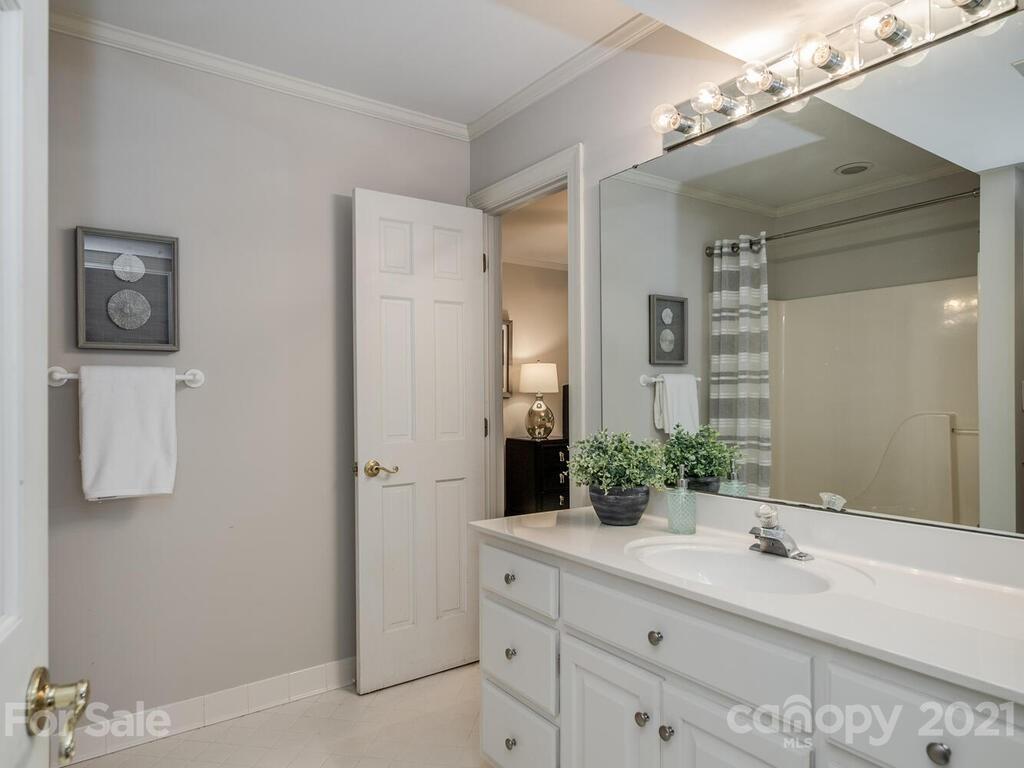 4626 Binfords Ridge Road Charlotte, NC 28226 - Photo 37 of 42 a bathroom with a double vanity sink and a mirror