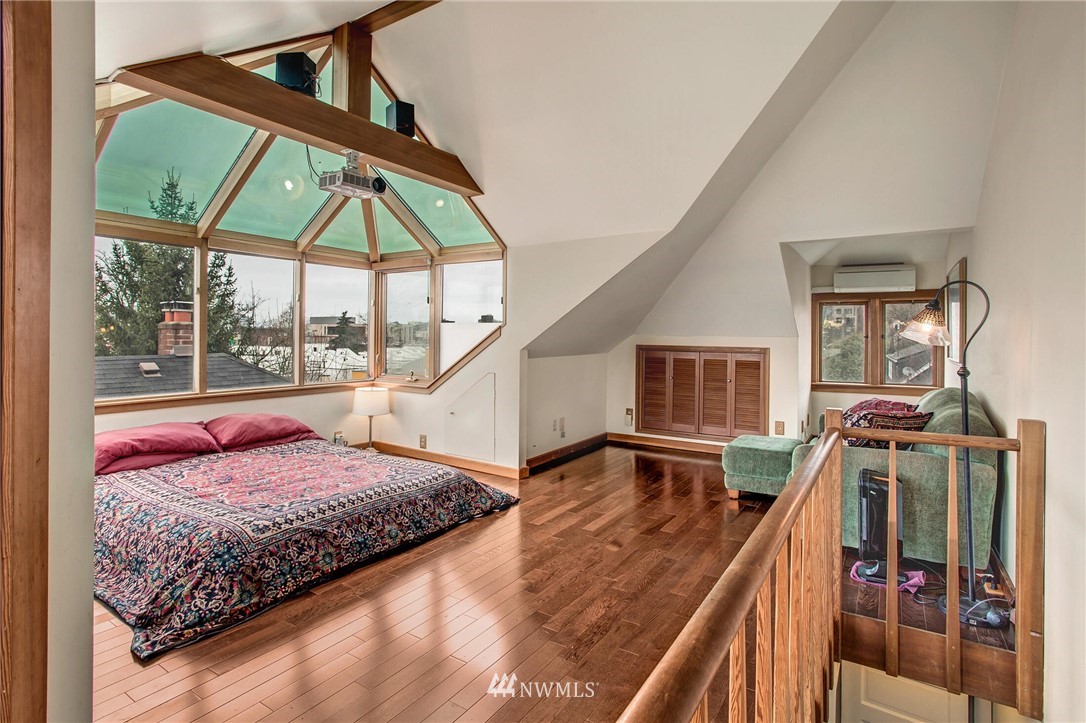 1415 East Spring Street Seattle, WA 98122 - Photo 19 of 38 a bed room with furniture and a window