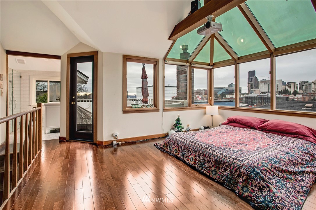 1415 East Spring Street Seattle, WA 98122 - Photo 21 of 38 a bedroom with a bed and a large window