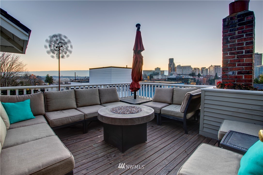 1415 East Spring Street Seattle, WA 98122 - Photo 26 of 38 a view of a roof deck with couches and potted plants