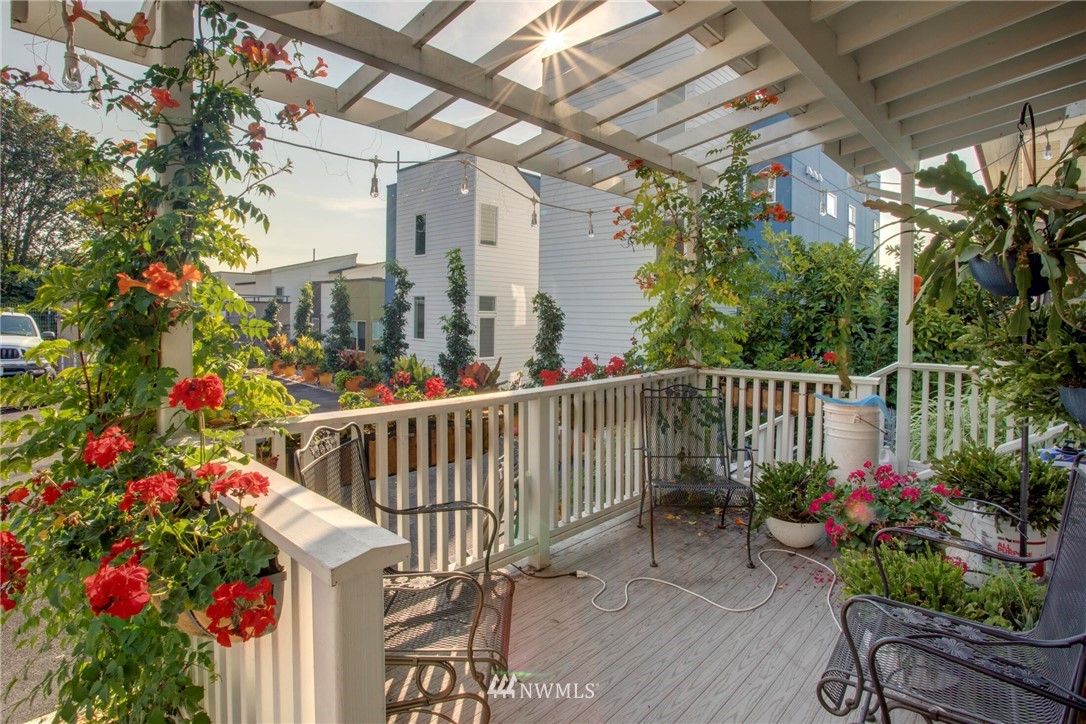 1415 East Spring Street Seattle, WA 98122 - Photo 27 of 38 a view of a porch with a flower garden