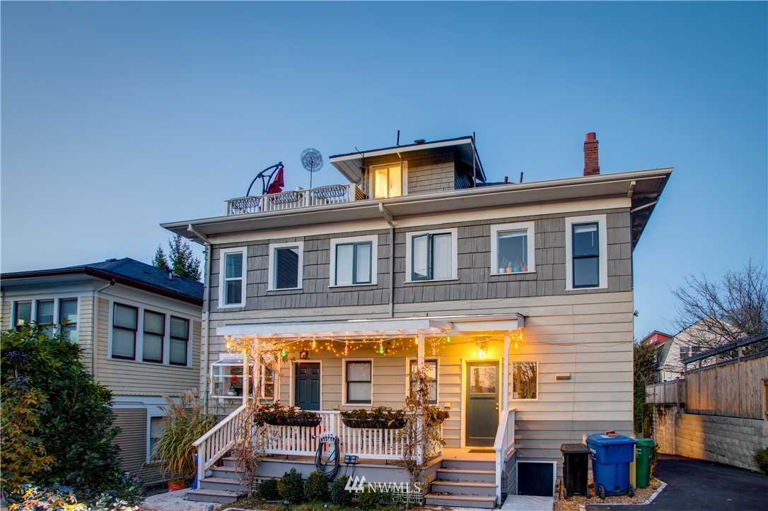 1415 East Spring Street Seattle, WA 98122 - Photo 30 of 38 a front view of residential houses with yard