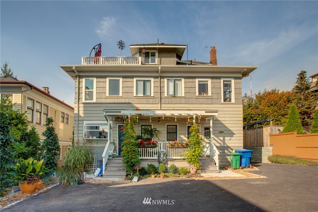 1415 East Spring Street Seattle, WA 98122 - Photo 33 of 38 a front view of a house with a garden