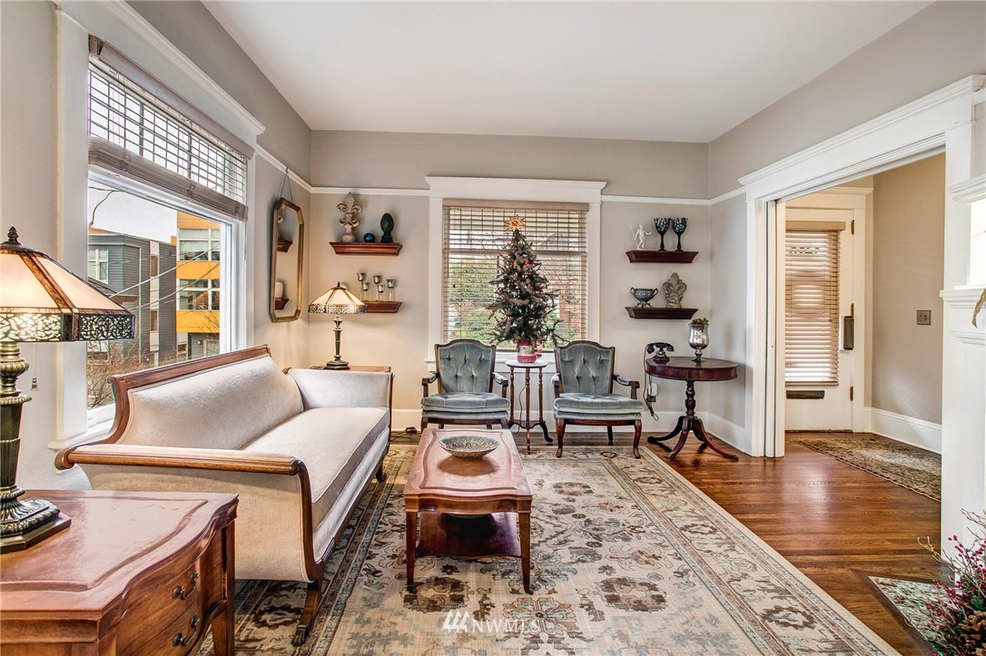 1415 East Spring Street Seattle, WA 98122 - Photo 7 of 38 a living room with furniture large window and wooden floor