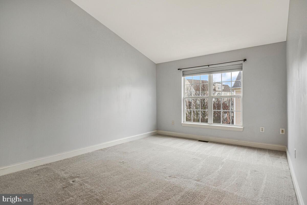 8045 Gatehouse Road, Unit 17 Falls Church, VA 22042 - Photo 16 of 32 an empty room with a window