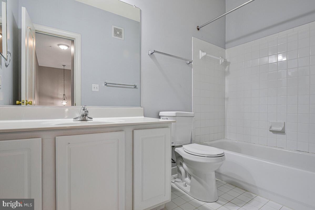 8045 Gatehouse Road, Unit 17 Falls Church, VA 22042 - Photo 20 of 32 a bathroom with a sink toilet and shower