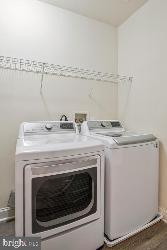 8045 Gatehouse Road, Unit 17 Falls Church, VA 22042 - Photo 22 of 32 a utility room with dryer and washer