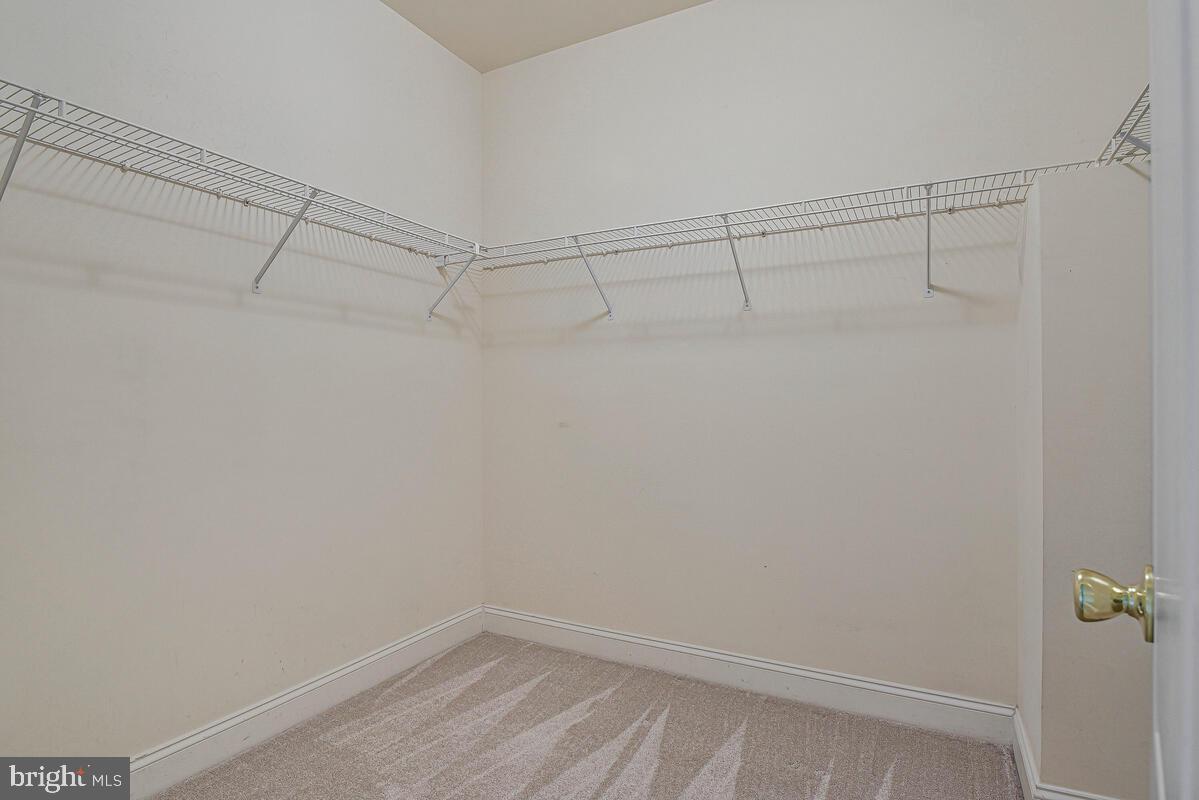 8045 Gatehouse Road, Unit 17 Falls Church, VA 22042 - Photo 25 of 32 a view of a room with racks on the wall