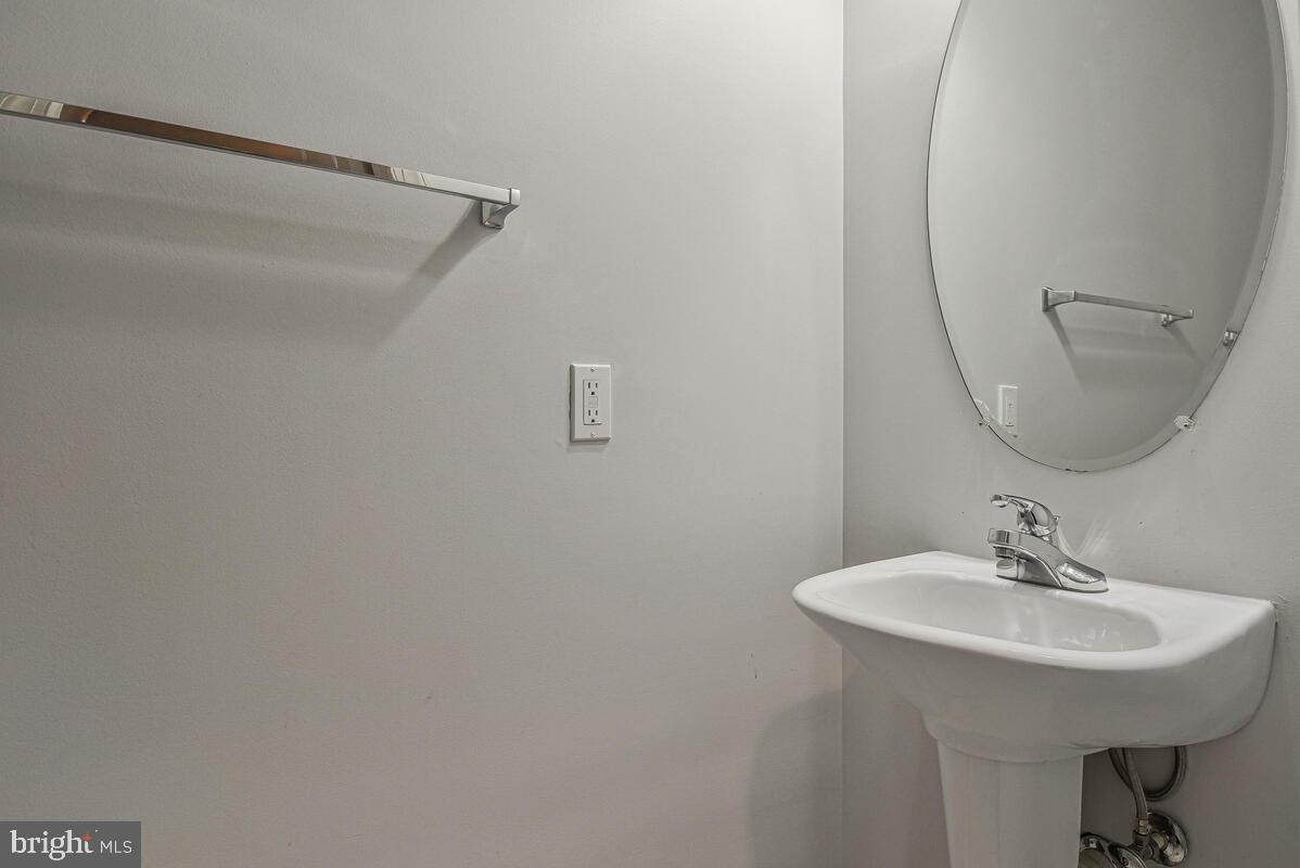 8045 Gatehouse Road, Unit 17 Falls Church, VA 22042 - Photo 4 of 32 a bathroom with a sink and a mirror
