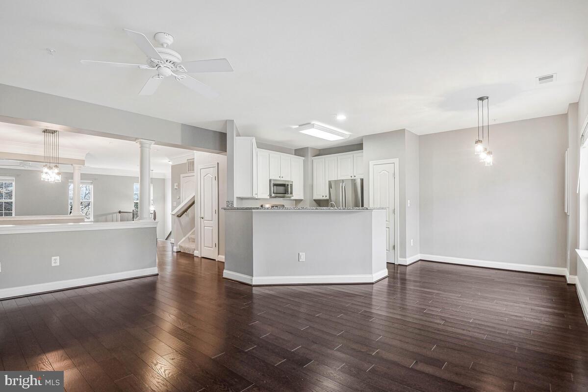 8045 Gatehouse Road, Unit 17 Falls Church, VA 22042 - Photo 8 of 32 a view of a kitchen with wooden floor and a kitchen