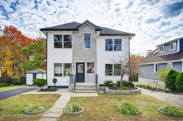 front view of a house with a yard