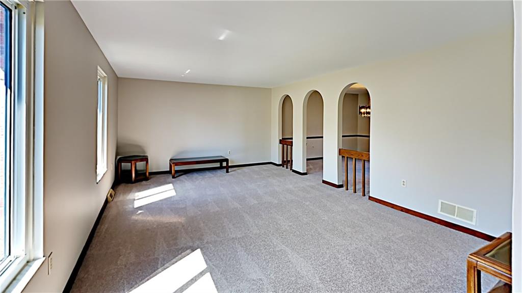 218 Ridgeview Drive Wexford, PA 15090 - Photo 7 of 25 Living room with arched openings to dining room.