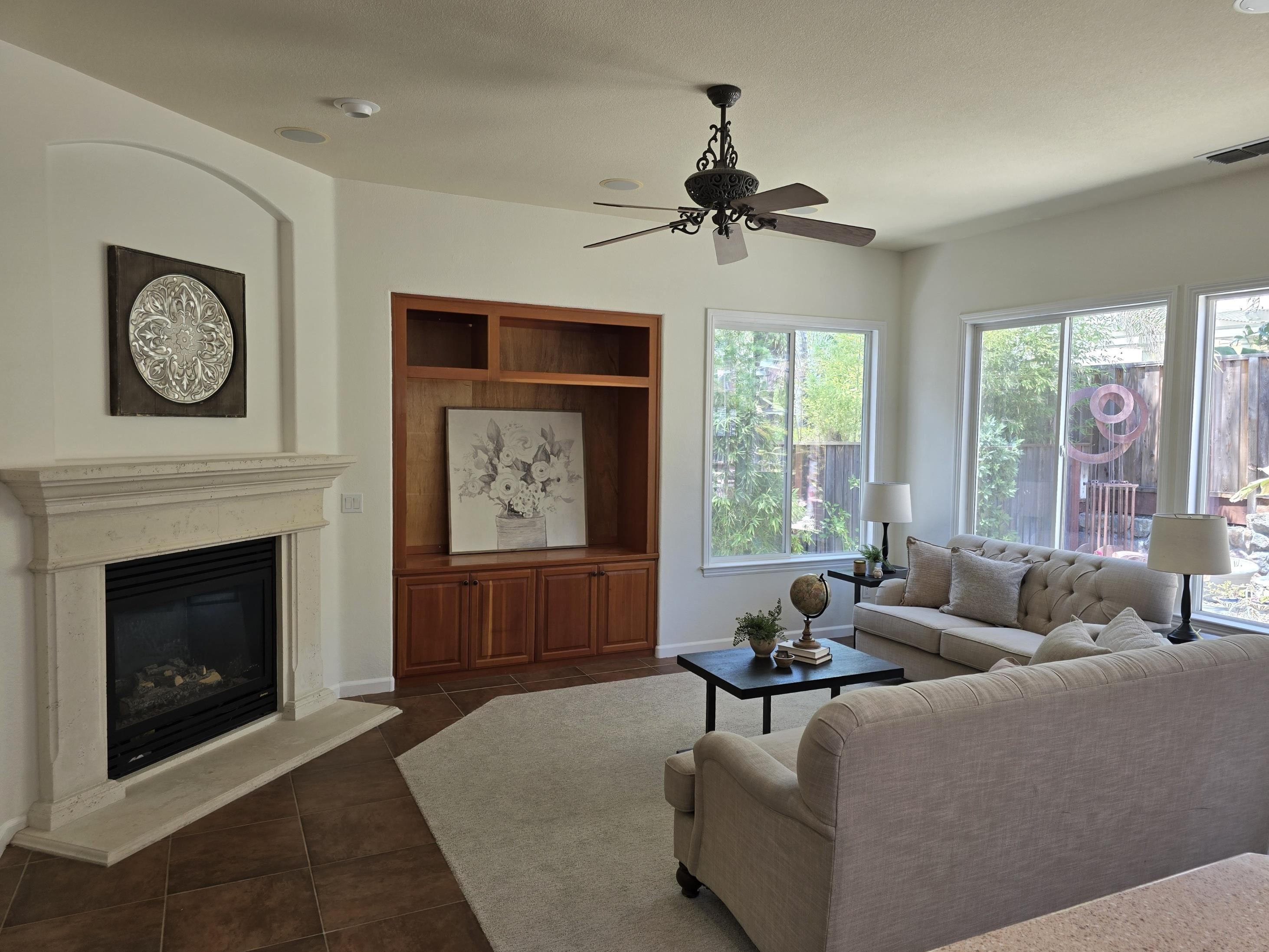 3146 Castle Rock Loop Discovery Bay, CA 94505 - Photo 14 of 49 a living room with furniture a window and a fireplace