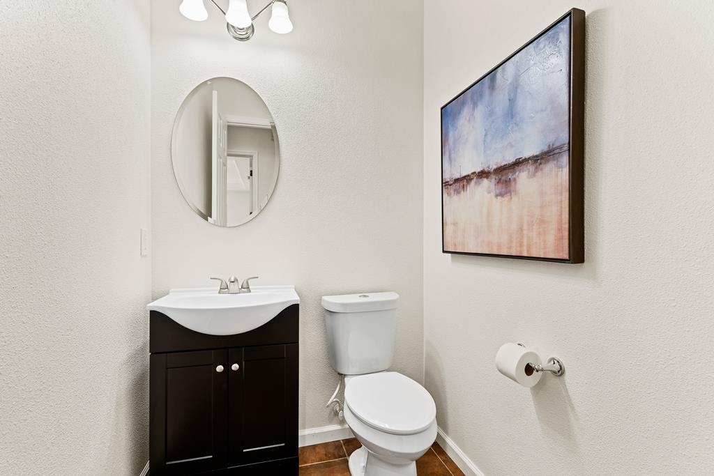 3146 Castle Rock Loop Discovery Bay, CA 94505 - Photo 22 of 49 a bathroom with a toilet a sink and mirror