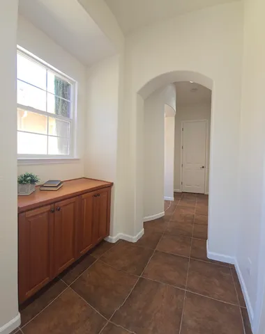 a room with windows and cabinet