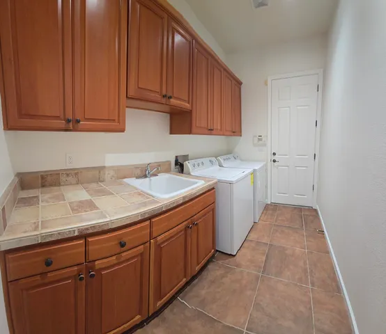 a kitchen with a sink and cabinets