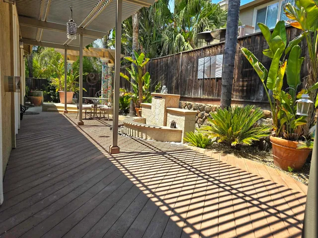 a view of a backyard with sitting area