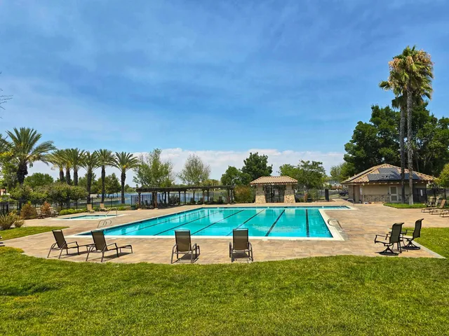 a view of a swimming pool with an ocean view