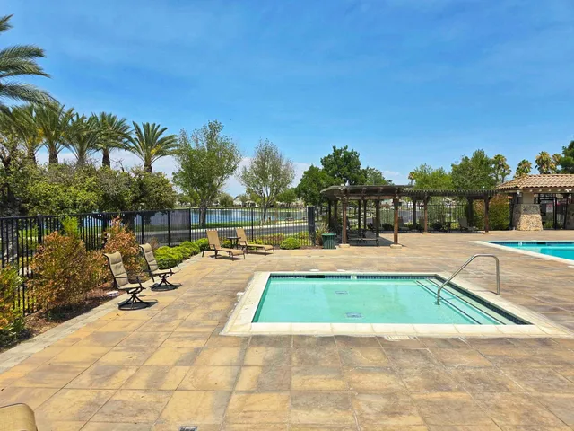 a view of swimming pool with chairs