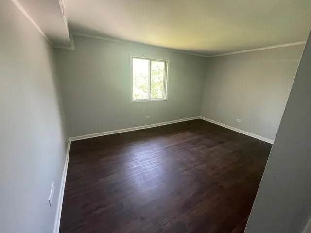 a bathroom with a toilet sink and shower